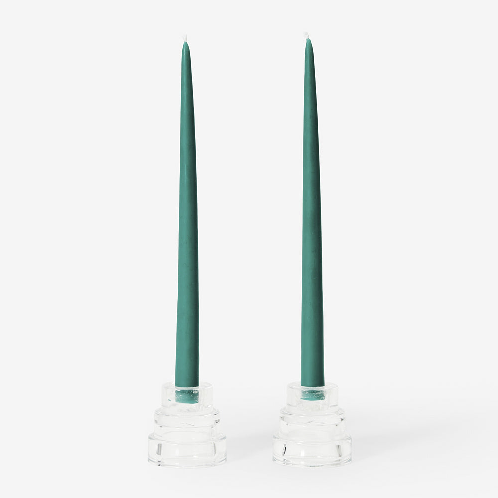 Two beeswax candles on display.