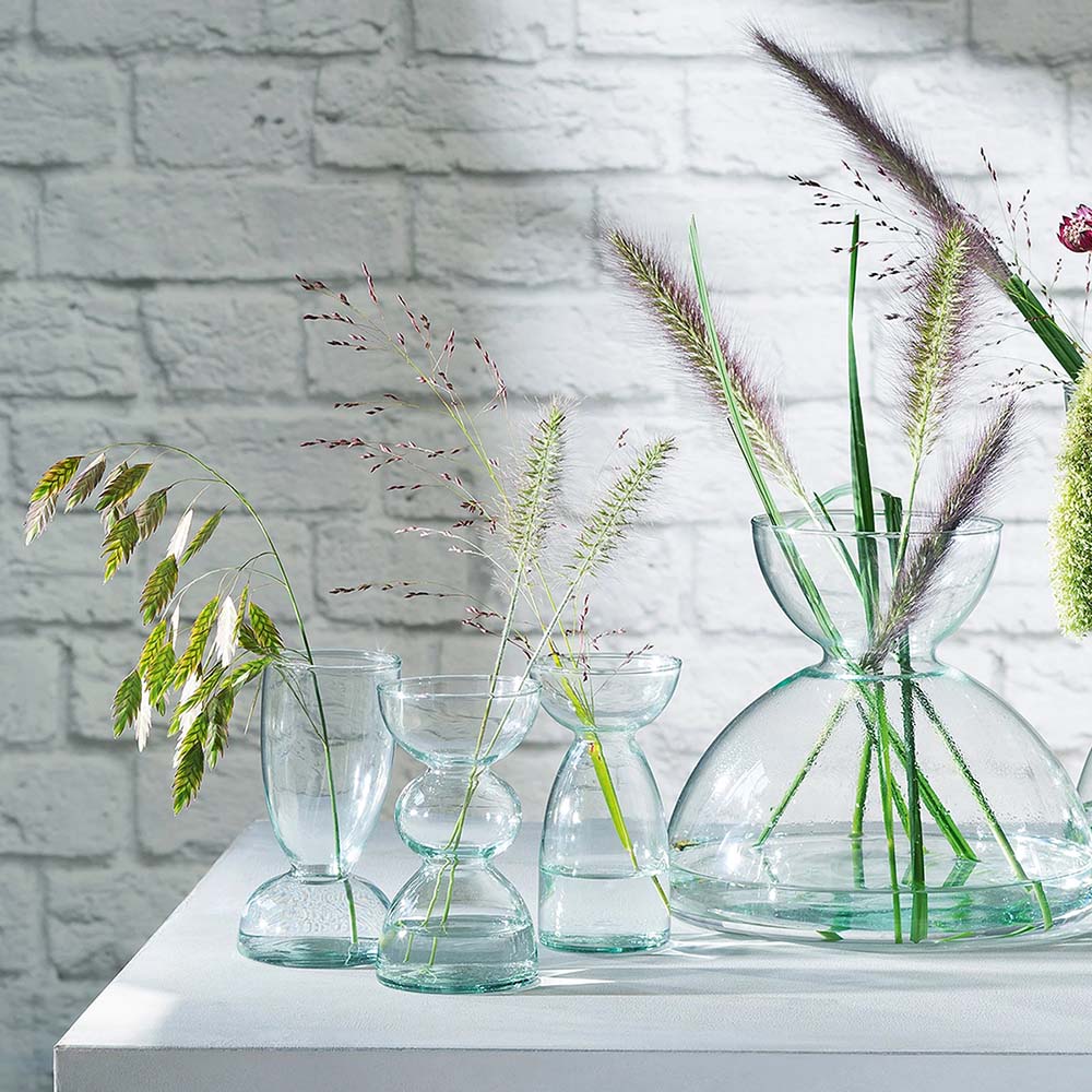 The Canopy Trio Vase Set of 3 on display with other vases.