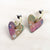 Photo of the Corazon Heart Earrings by Sibilia on white background.