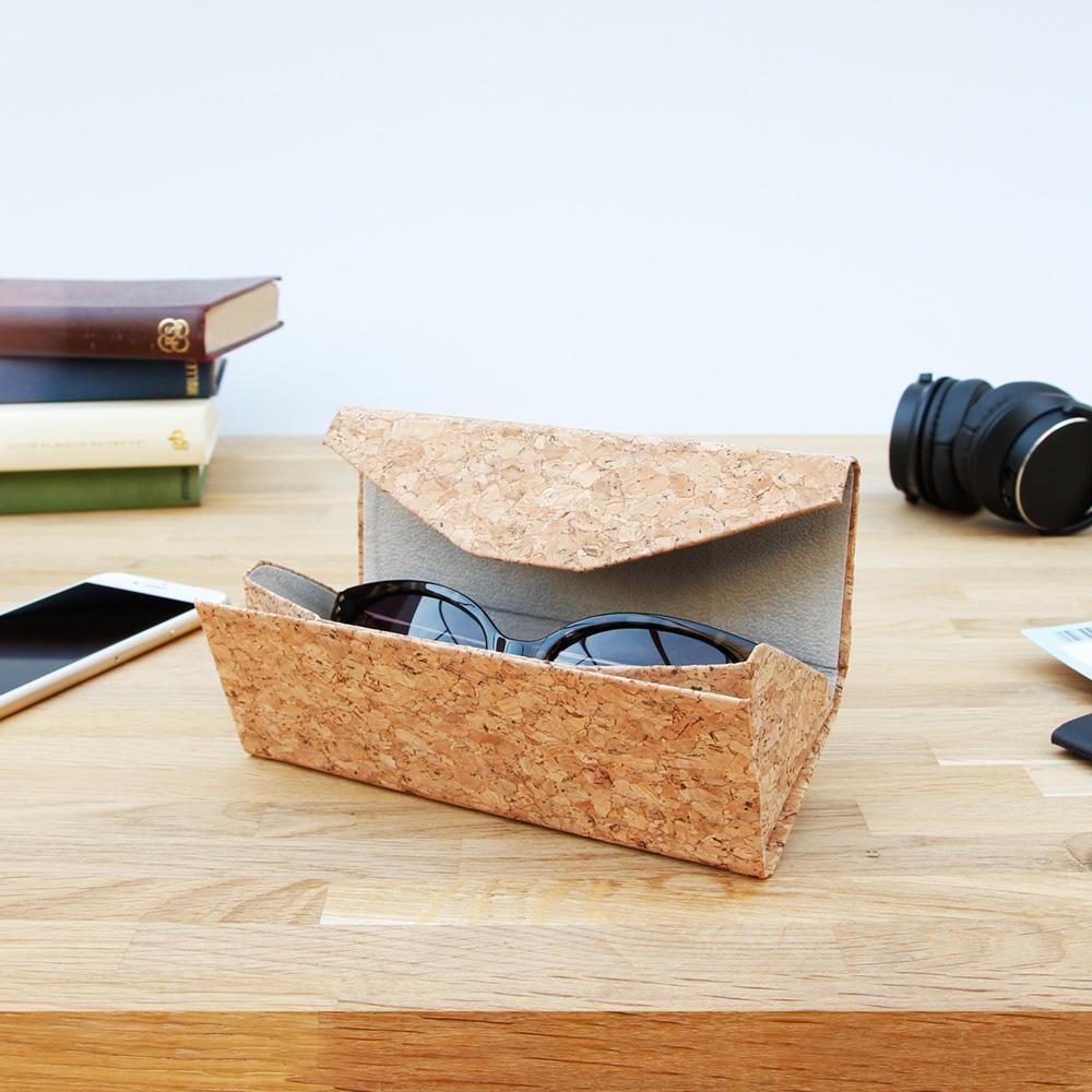 The Cork Sunglass Case displayed on a desk. 