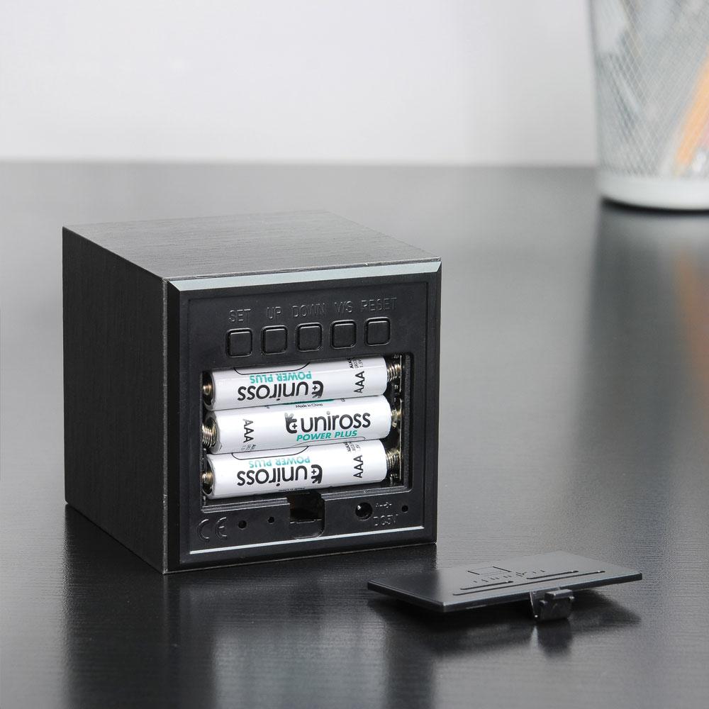 Rear view of the Black Cube Click Clock&#39;s battery pocket.