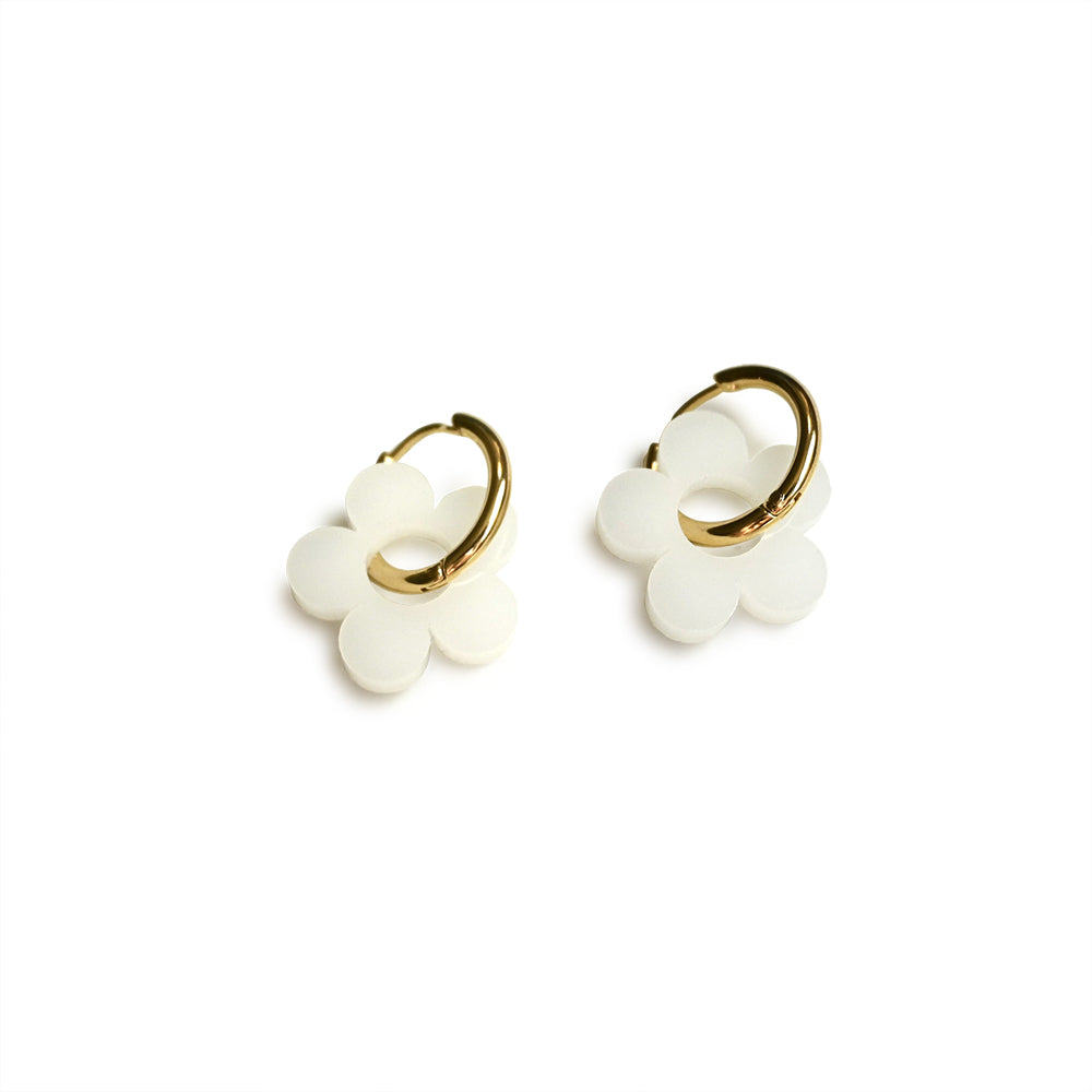 Daisy Huggie Hoop Earrings by Shape &amp; Color, white daisies with gold-plated hoops.