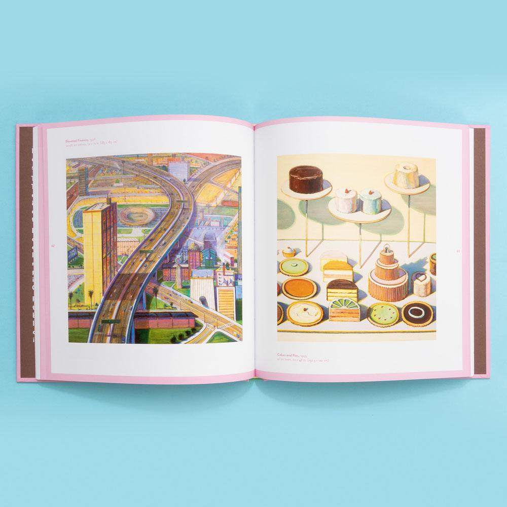 A painting of a highway and a painting of multiple cakes featured in Wayne Thiebaud: Delicious Metropolis.