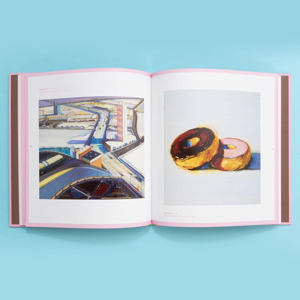 Paintings of a highway overpass and two doughnuts from Wayne Thiebaud: Delicious Metropolis.