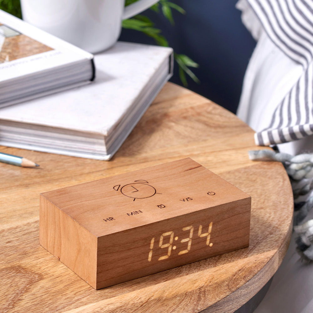 The Flip Click Clock: Cherry displayed on a table on its 24 hour setting.