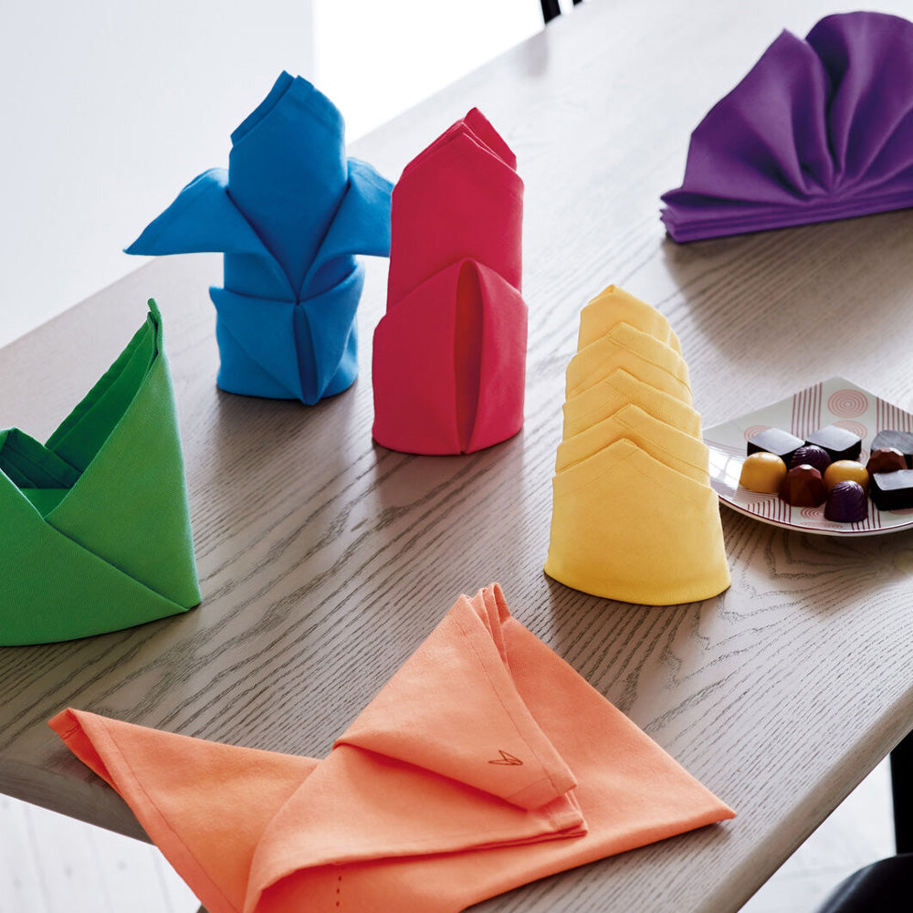 Close-up of folded napkins on table.