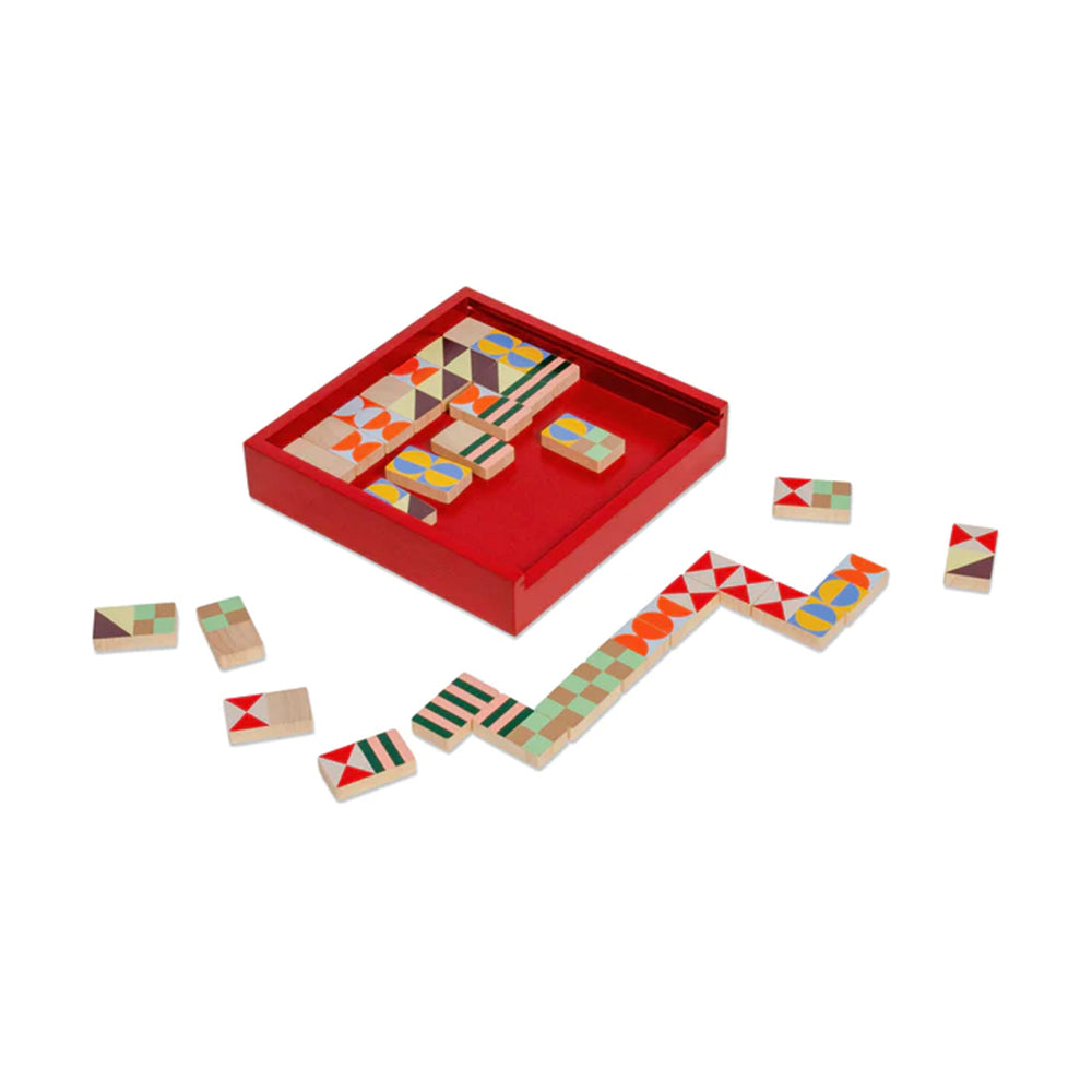 Geo Pattern Dominoes Set by Panisa Khunprasert/MoMA. Red box with multicolor wood domino pieces.