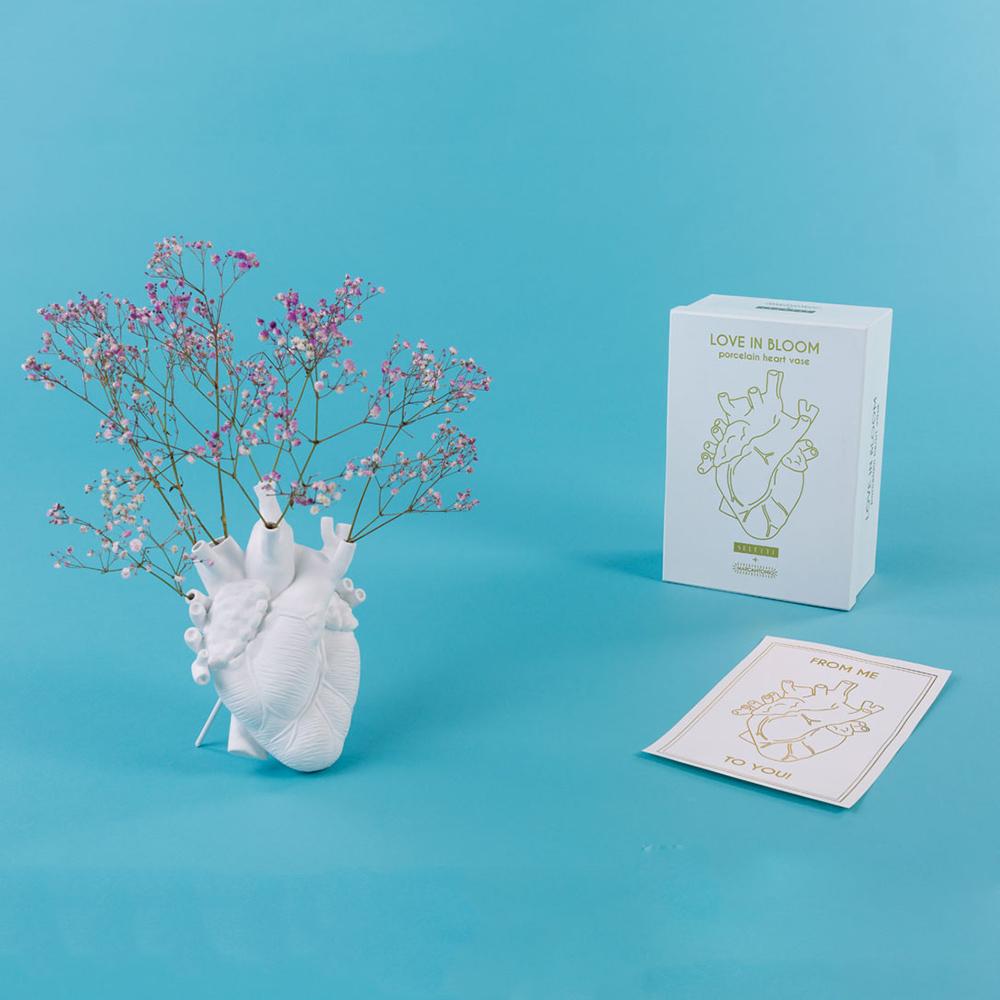 The Porcelain Heart Vase: White displayed with its packaging and greeting card.