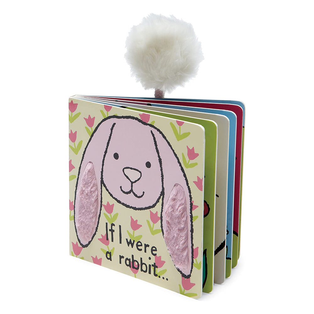Three-quarter view of board book with pom pomon top.