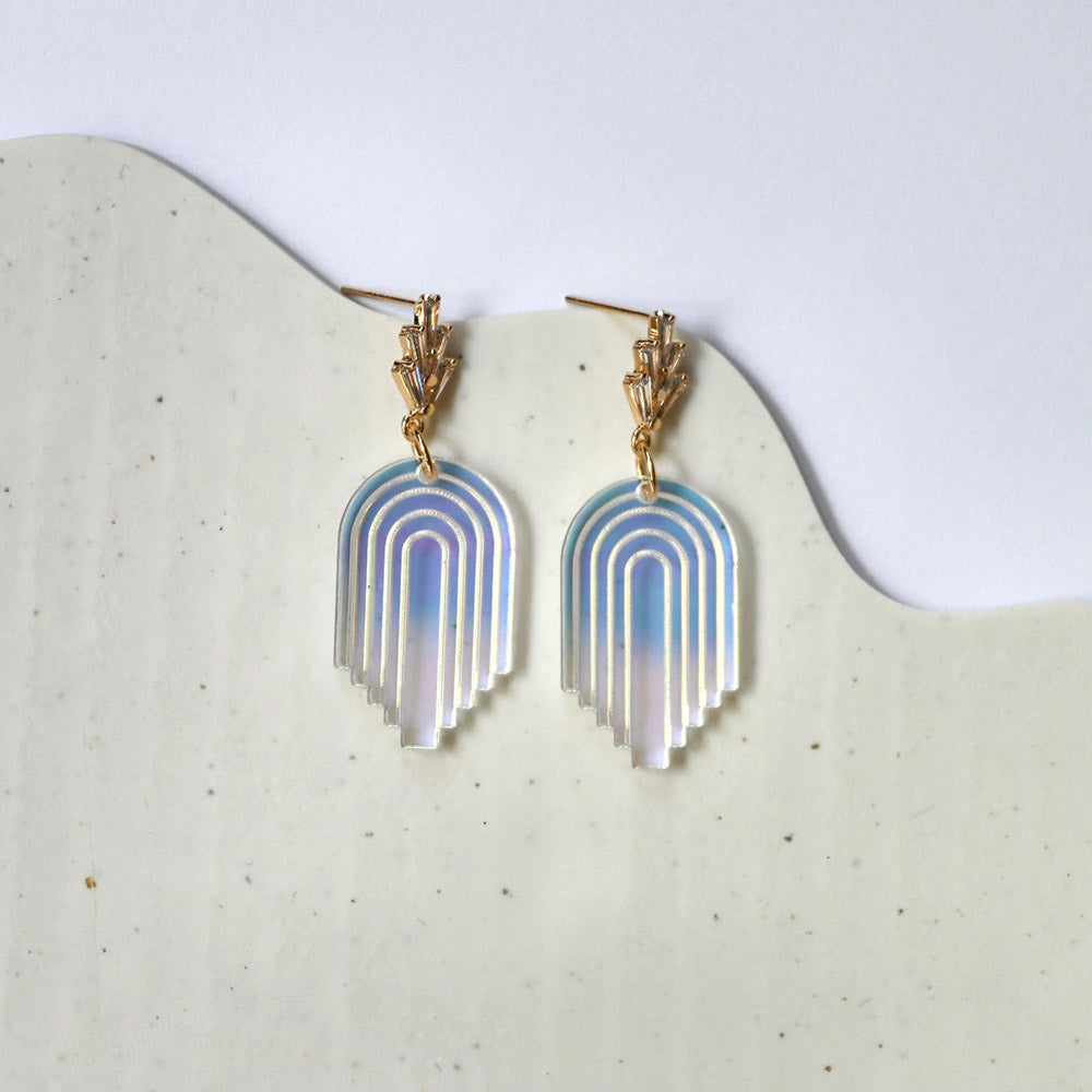 Deco Arch Earrings by Shape + Color on geometric stone.