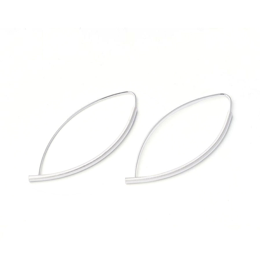 Kelim Asymmetrical Hoop Earrings on display.
