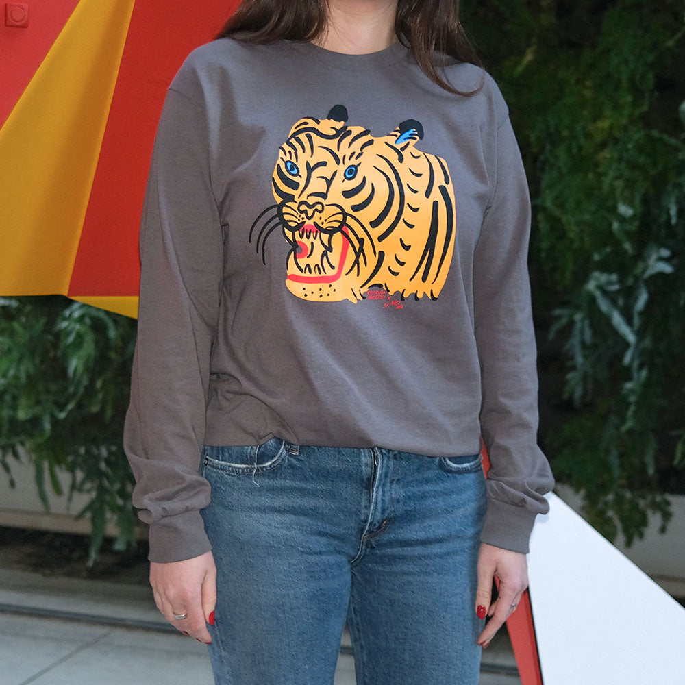 Model wearing Kristina Micotti Tiger T-shirt in SFMOMA sculpture garden.
