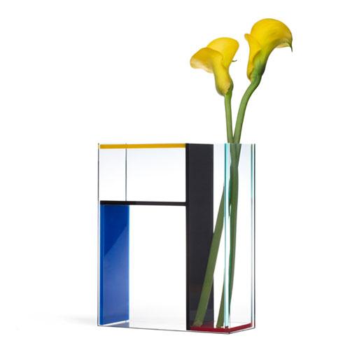 The Mondri Vase displayed vertically with yellow flowers.