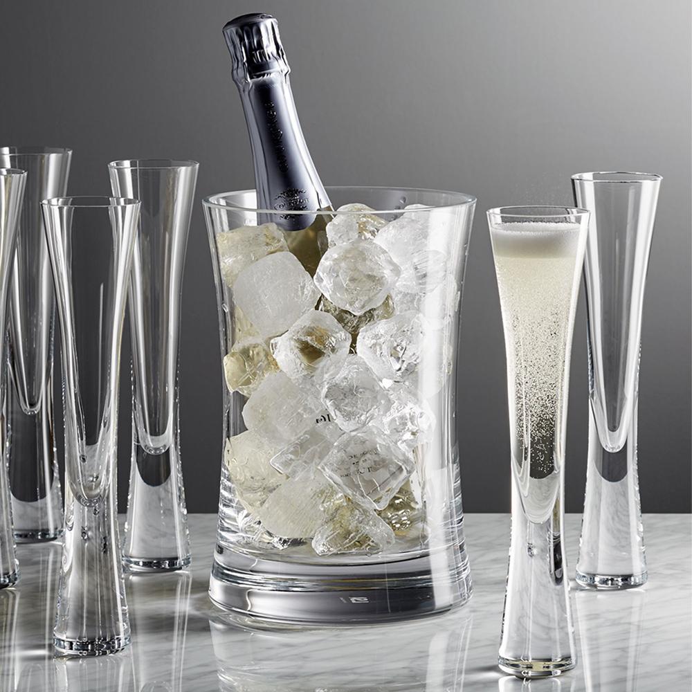 Several Moya Champagne Flutes around an ice chilled champagne bottle.