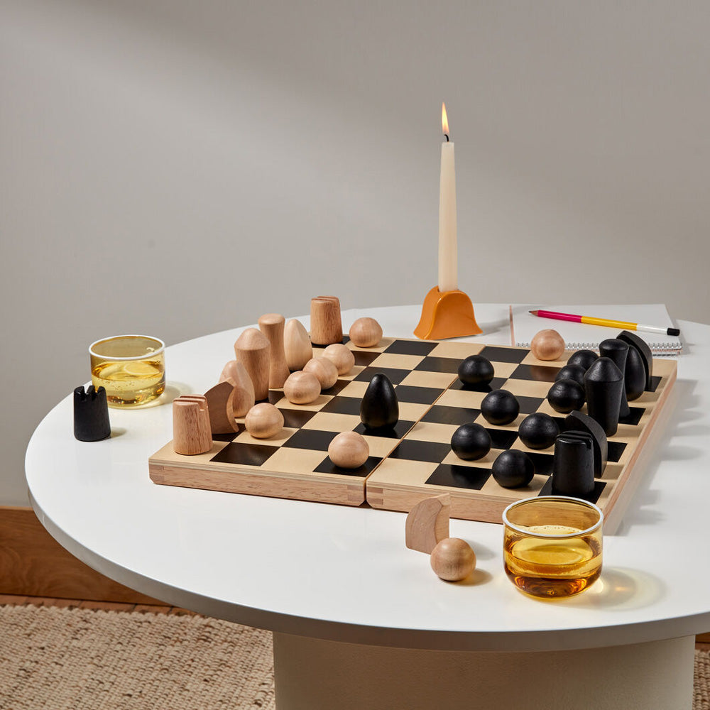Chess set on table.