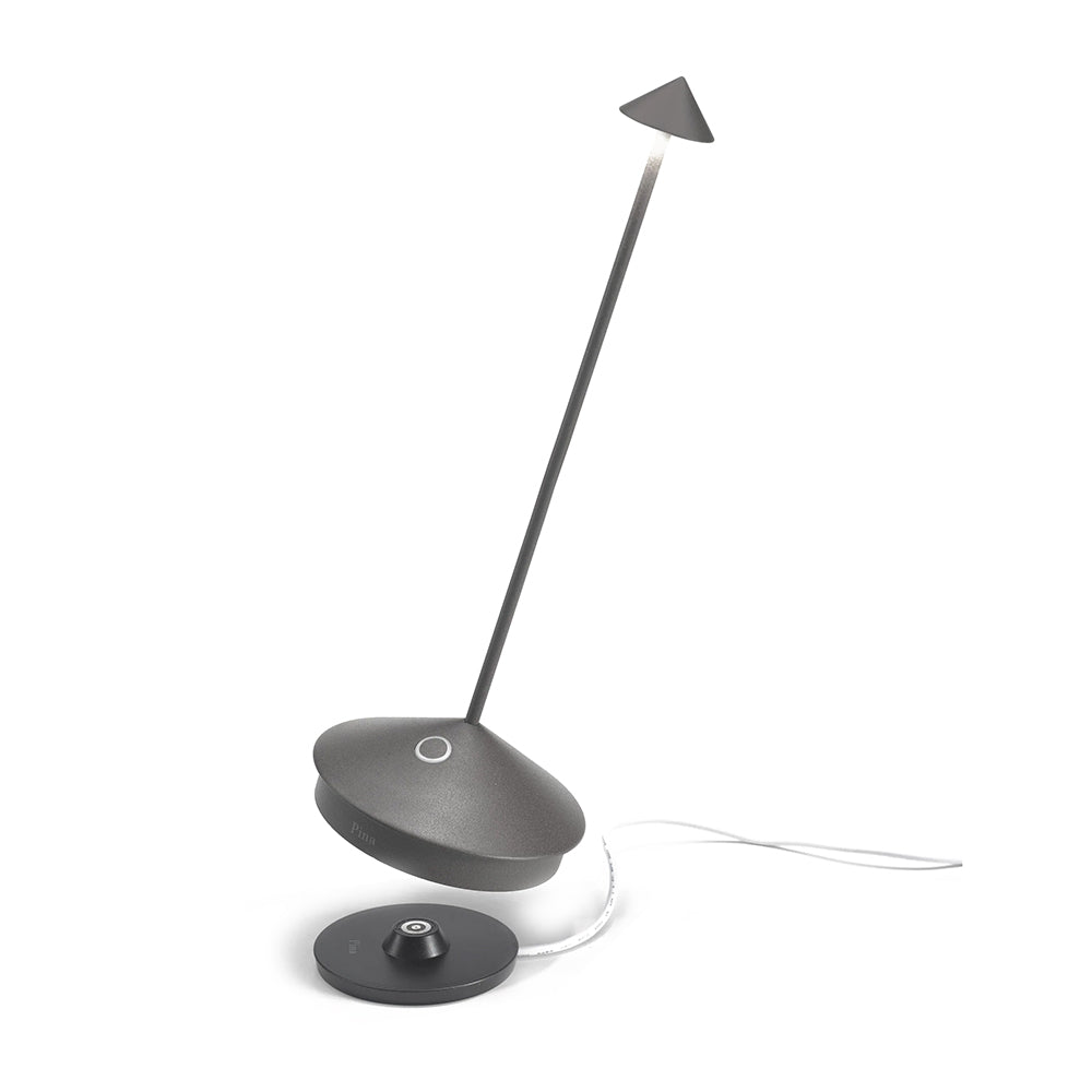 Pina Lamp Dark Grey with tabletop charger.