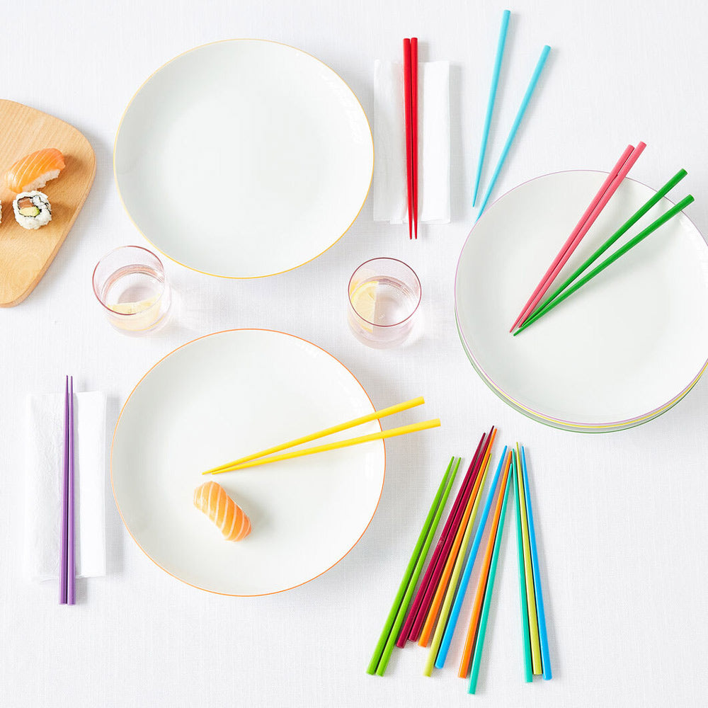 Chopsticks on dinner table lifestyle image.
