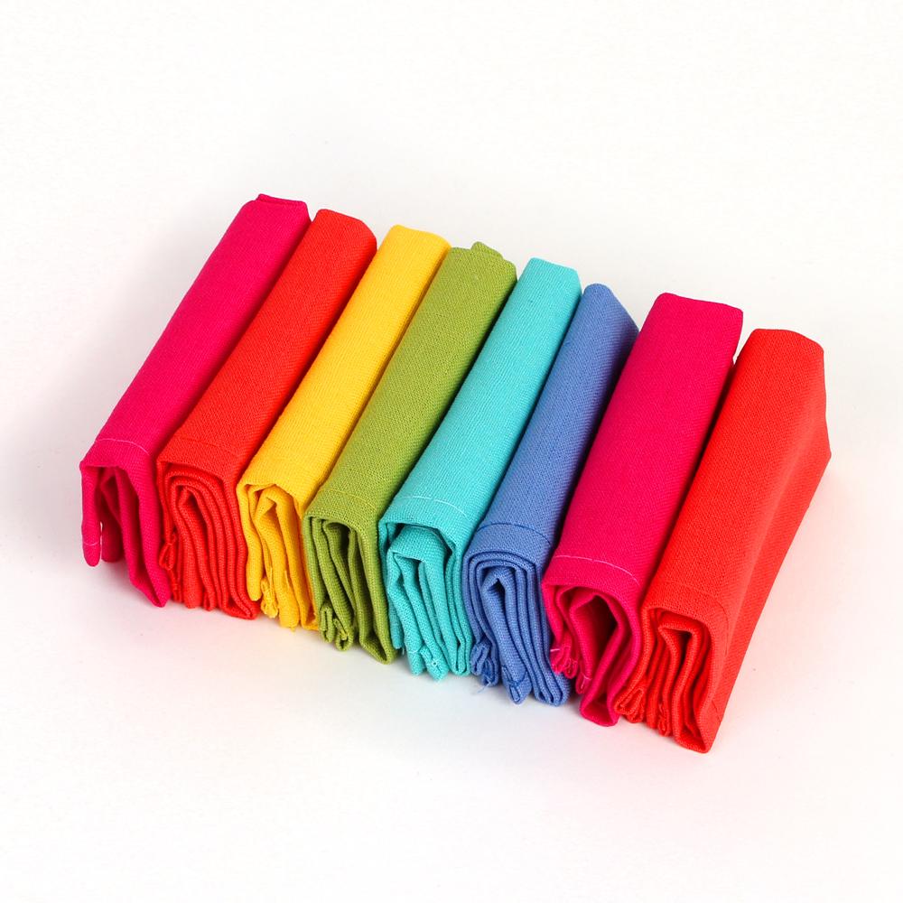 Rainbow Cocktail Napkins: Set of 8 stacked side by side in a line.