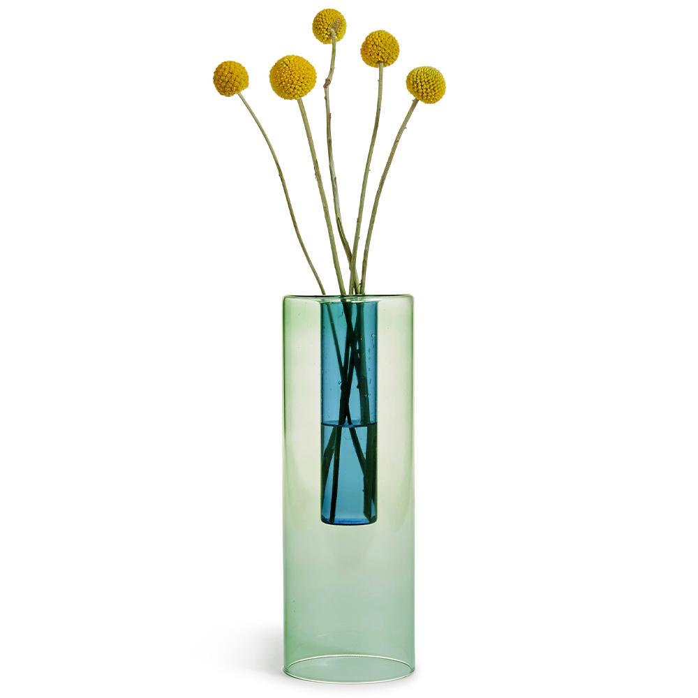 Reversible Vase: Green + Blue displayed with flowers.