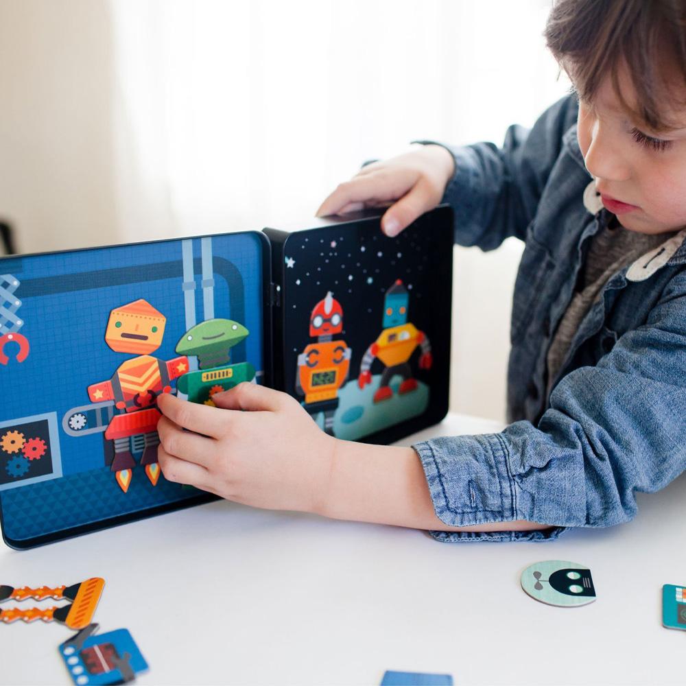 A child playing with the Robot Remix Magnetic Play Set.