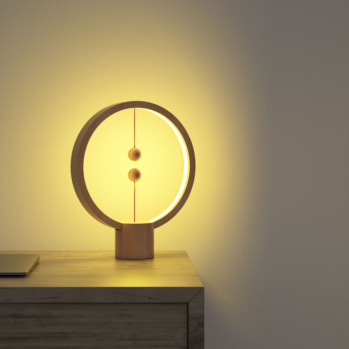The Heng Round Light Wood lights the wall in a room.