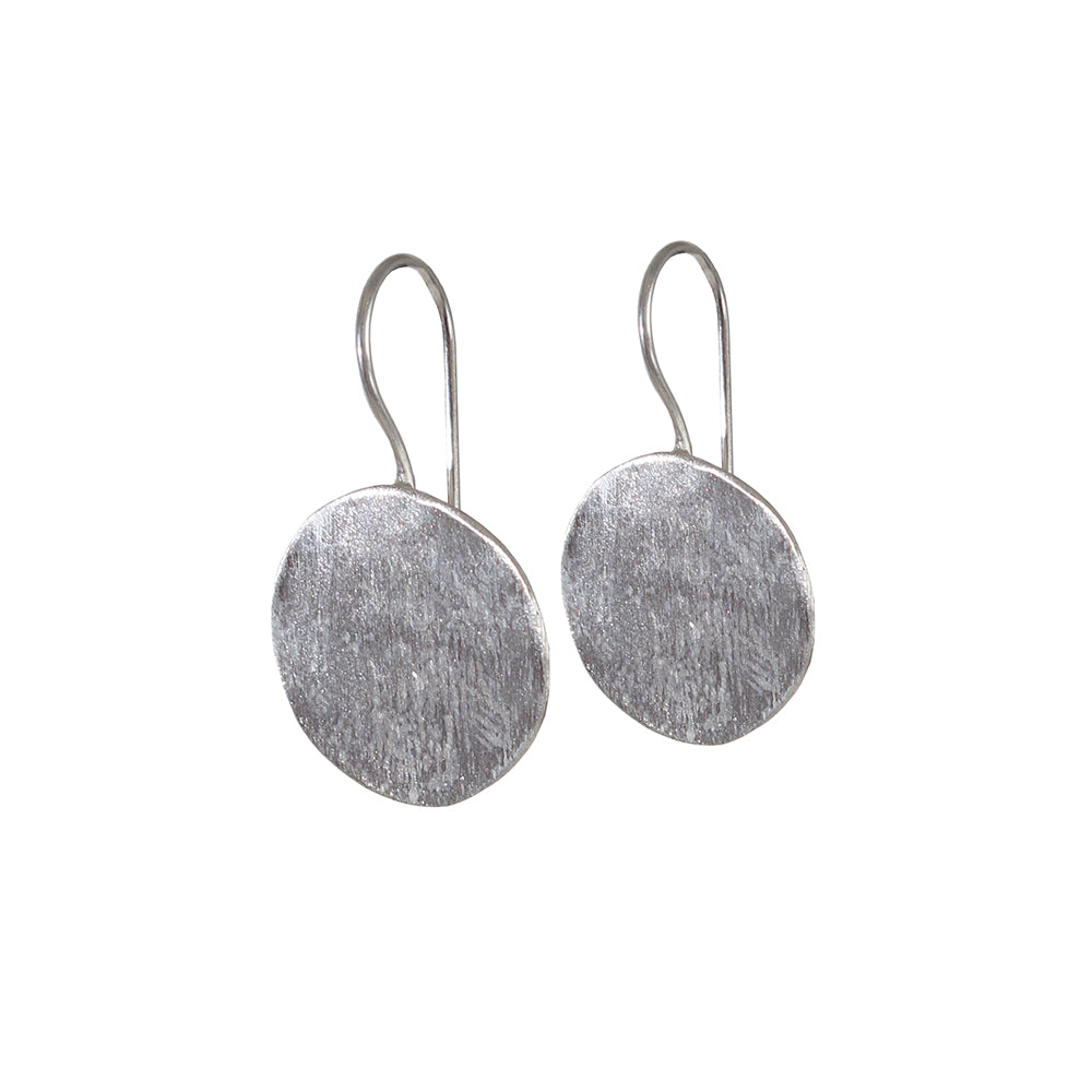 Photo of Silver Coin Earrings by River Burke on white background.