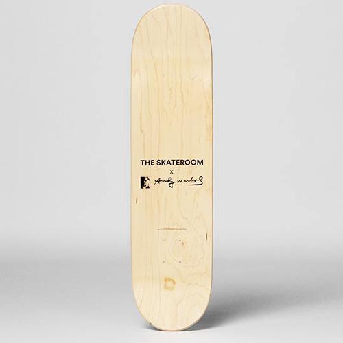 The Warhol Soup Can Skateboard: Beige displayed upright.