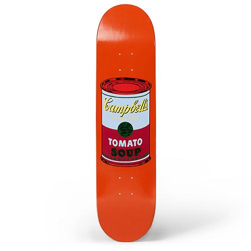 The Warhol Soup Can Skateboard: Purple on Orange displayed standing.