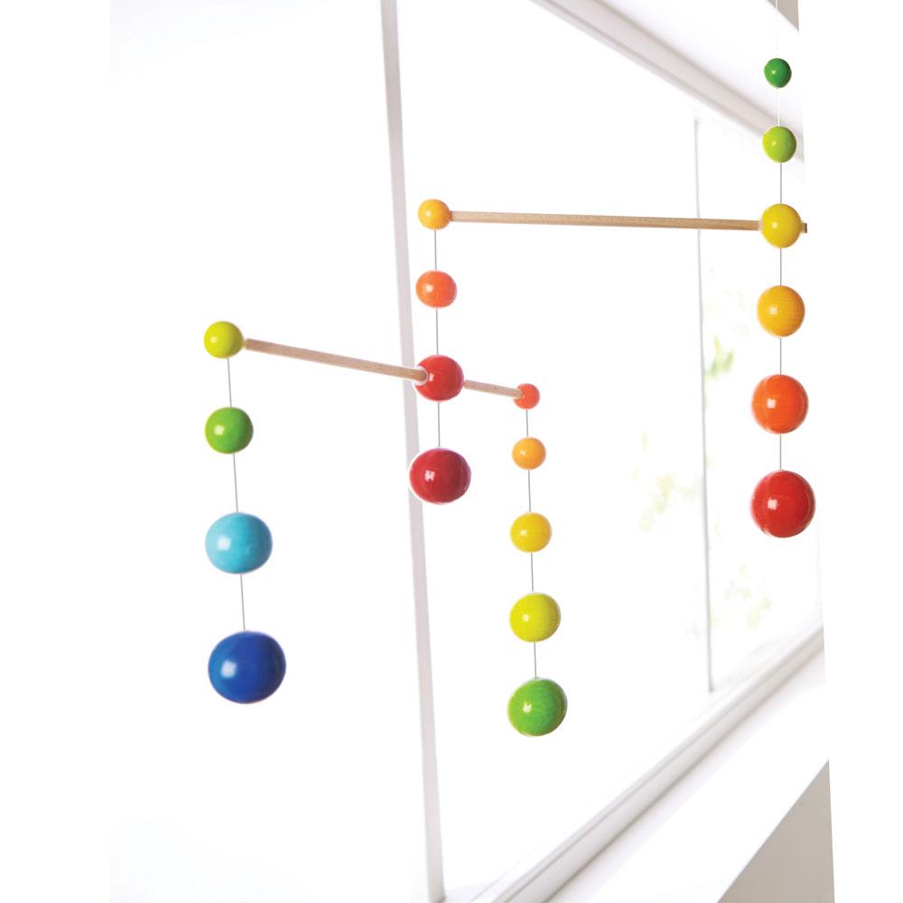 Rainbow Ball Mobile hung in a sunny room.