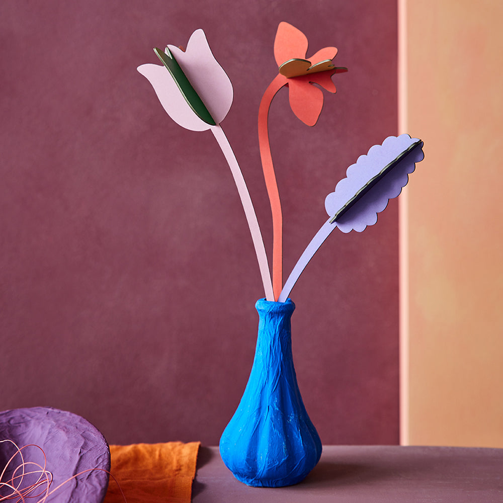 Photo of assembled Springtime Surprise flowers by Studio Roof, in blue vase en scene.