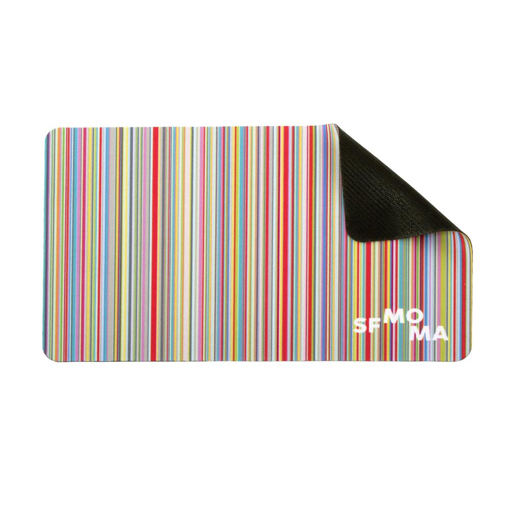 SFMOMA Stripe Travel Mousepad with the right corner folded to show its rubber base.