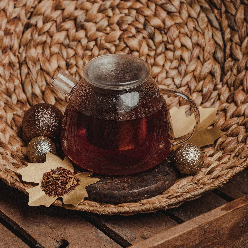 Brewing teapot on decorative basket.