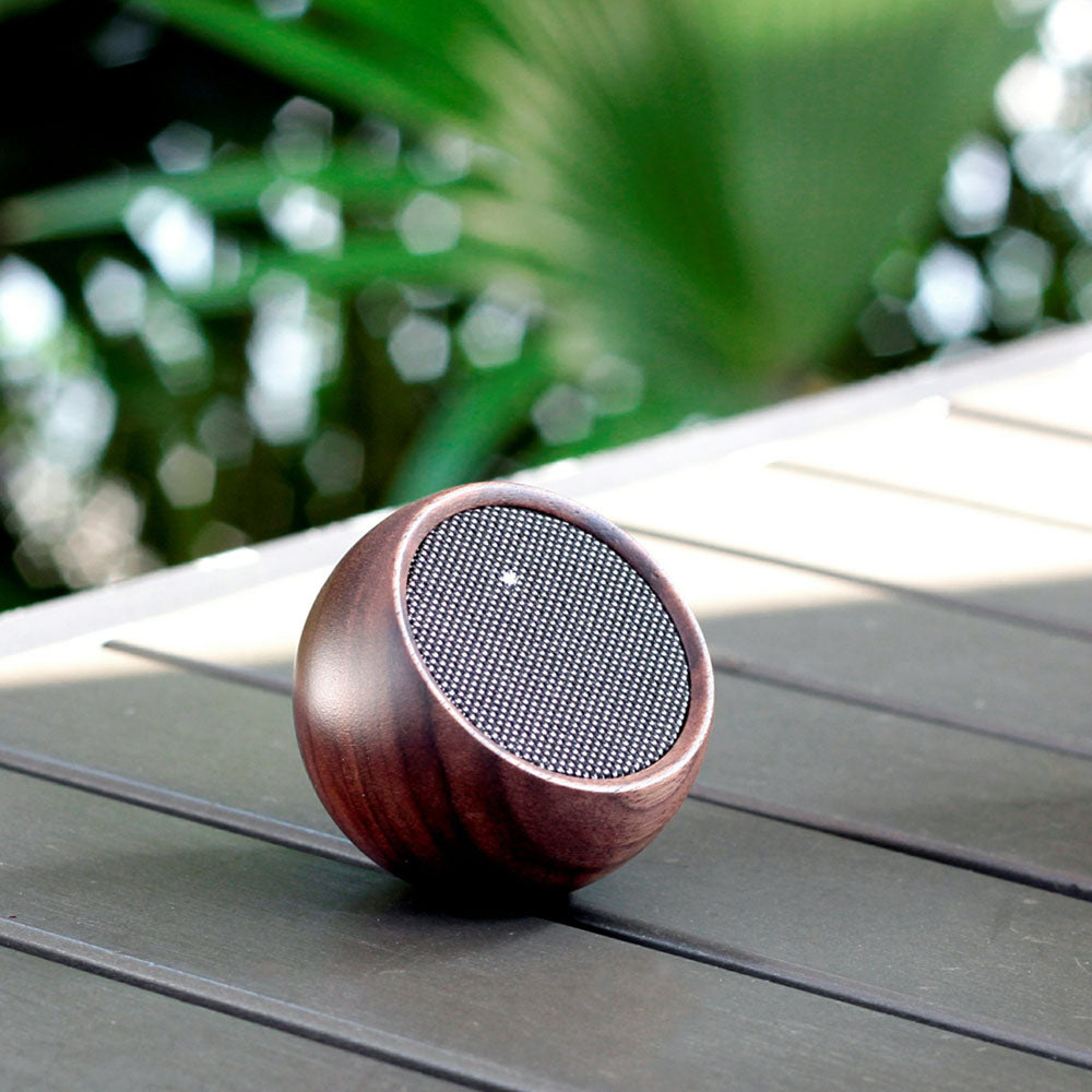 The Tumbler Selfie Speaker: Walnut on display.
