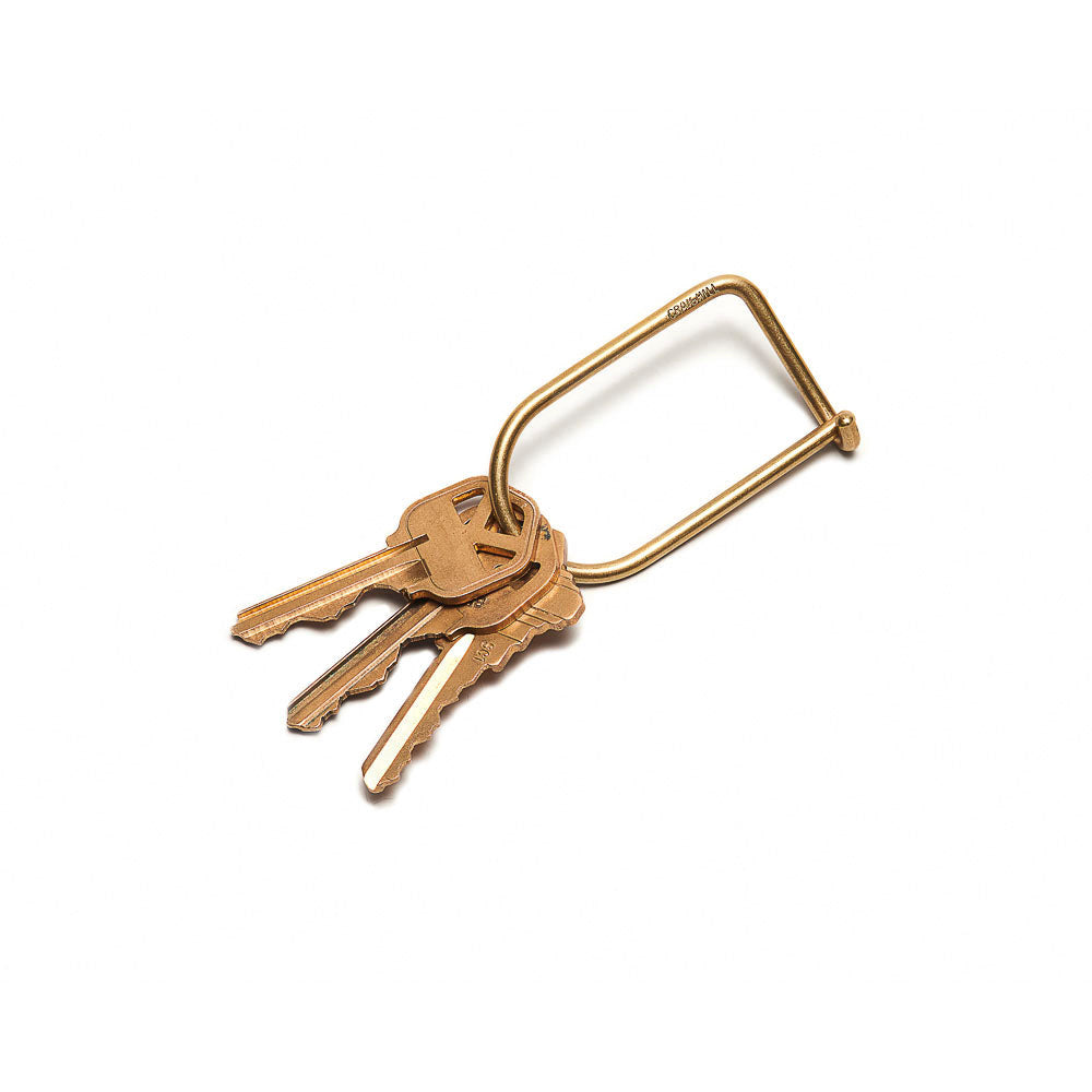 An open Wilson Keyring: Brass displayed with three keys.