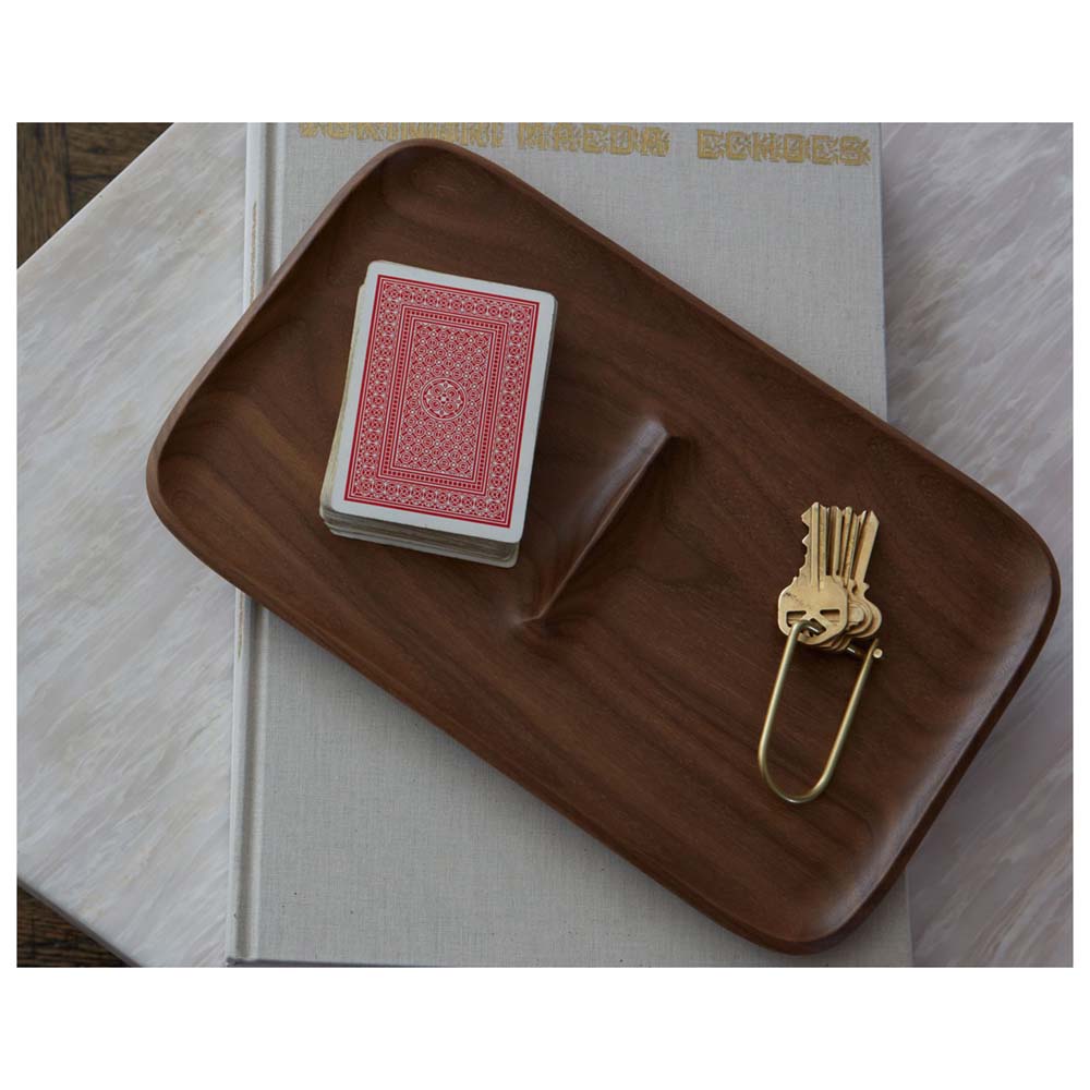 A Wilson Keyring: Brass in a tray with a deck of cards.